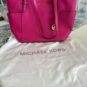 Michael Kors Fuchsia Tote Bag and white protective bag